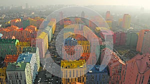 Fog over a residential area with colored buildings