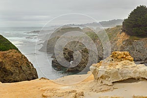 Fog over rugged terrane of Mendocino Headlands State Park. photo