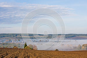 Fog over the village early in the morning