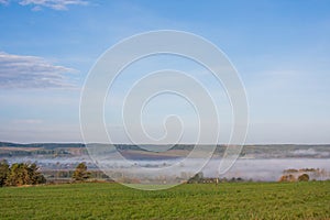 Fog over the village early in the morning