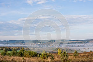 Fog over the village early in the morning