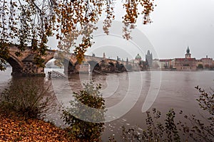 Fog over the Vltava river near Charles Bridge