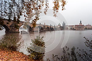 Fog over the Vltava river near Charles Bridge