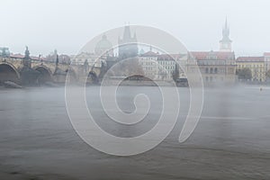 Fog over the Vltava river near Charles Bridge
