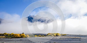 Fog on plain in New Zealand mountains