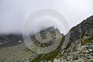 Fog and rain clouds over high mountain peaks High Tatras Slovakia