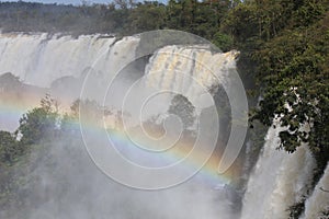 Fog and rainbow above the waterfall - Iguazu Falls in Argentina