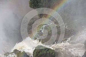 Fog and rainbow above the waterfall - Iguazu Falls in Argentina