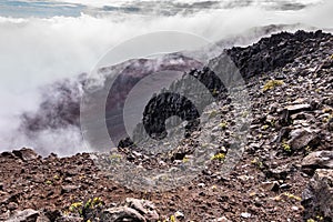 Fog rises out of crater of Haleakala Volcano, Maui, Hawaii, USA