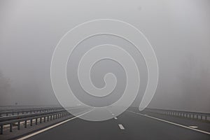 Fog on road motorway, danger in traffic