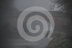 Fog shrouded Kennet and Avon canal bridge