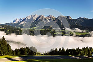 Fog in valley over Schladming, Dachstein Mountains, Alps, Austria