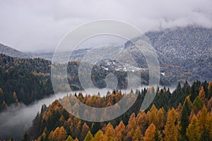 The fog in the valley of the river divides the autumn from winter