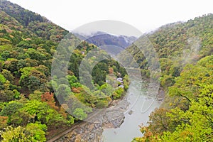 Foggy afternoon at Hozugawa River at Arashiyama park in Kyoto, J