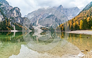 Foggy autumn morning at Lake Braies, Province of Bolzano, Trentino Alto Adige, Italy.