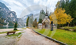 Foggy autumn morning at Lake Braies, Province of Bolzano, Trentino Alto Adige, Italy.