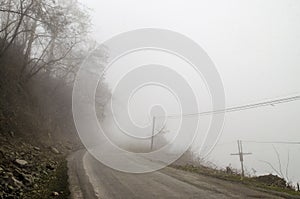 Foggy Country Road. Fog creates a feel of emptiness as it leads to seemingly nowhere. Ilisu, Gakh, Azerbaijan