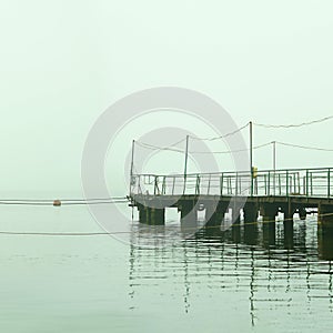 foggy dock. pier, autumn silence. calm. fishermen.