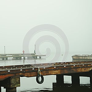 foggy dock. pier, autumn silence. calm. fishermen.