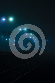 A foggy evening and a train leaving.