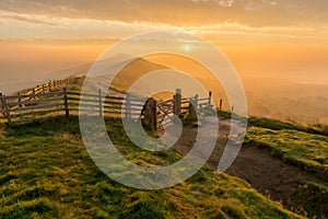 Foggy Golden Sunrise, Mam Tor, Peak District, UK. photo