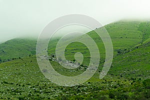 Foggy green hills. Albanian nature. Picturesque dreamland