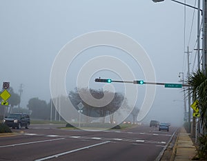 Foggy haze morning in Florida with traffic cars