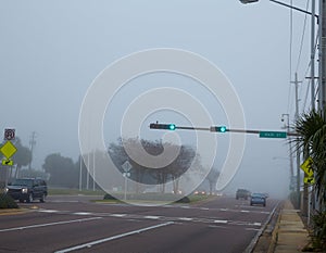 Foggy haze morning in Florida with traffic cars photo