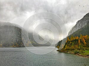 Foggy lake Gosau at Dachstein mountain in Salzkammergut, Austria