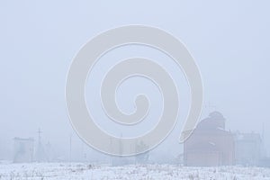 Foggy landscape of village. gray background