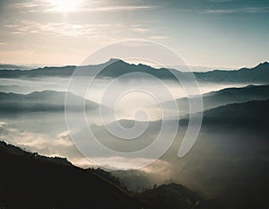 Foggy layers mountain landscape backlit