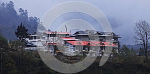 foggy and misty lachung hill station, a popular tourist destination in north sikkim