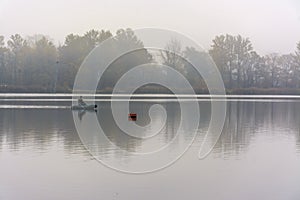 Foggy morning on the beach located on the shore  lake