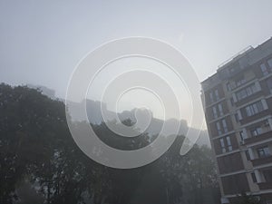 foggy morning in the city.  multi-storey buildings in the fog