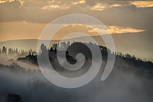 Foggy morning in the hills of Tuscany near San Gimignano, Tuscany, Italy.