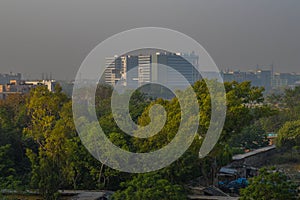 A foggy morning landscape view of city submerge of polluted city and unpolluted village