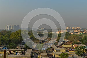 A foggy morning landscape view of city submerge of polluted city and unpolluted village photo