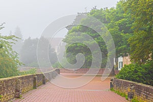 Foggy morning on the old city walls Stadtmauer in Ulm, Germany photo