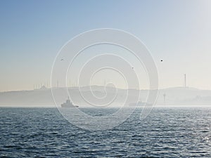 Foggy morning scenery of Istanbul`s Bosphorus strait in Turkey photo