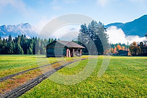 Foggy morning view of Mitterhofen village in the district of Zell am See in the Austrian state of Salzburg. Colorful autumn scene