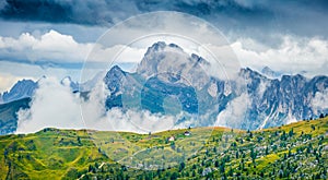 Foggy morning view of Sass de Stria peak from Giao pass. Breathtaking summer scene of Dolomiti Alps, Cortina d`Ampezzo location,