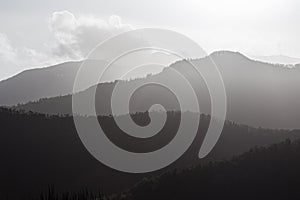 Foggy mountain peak landscape sun backlit