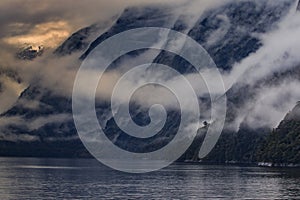 Foggy mountain scene in milfordsound fiordland national park sou