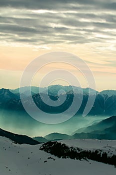 Foggy mountain scenery at sunset