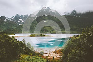 Foggy mountains and fjord landscape in Norway beach