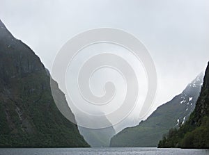 Foggy mountains in the norwegian fjords.