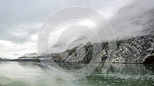 Foggy mountains and shoreline landscape from Alaska in Autumn.