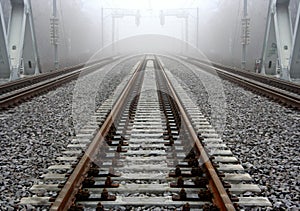 Foggy railroad track