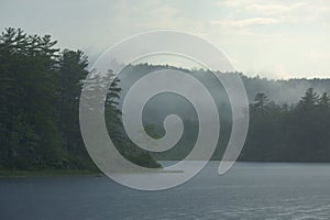 Summer shower over Beaver Pond in Allenstown, New Hampshire photo