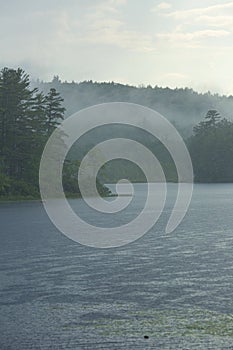 Summer shower over Beaver Pond in Allenstown, New Hampshire photo
